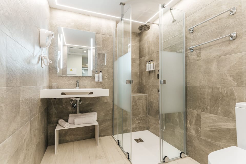 Single Room (Roam Solo) "Minibar no refill" | Bathroom | Free toiletries, hair dryer, towels, soap