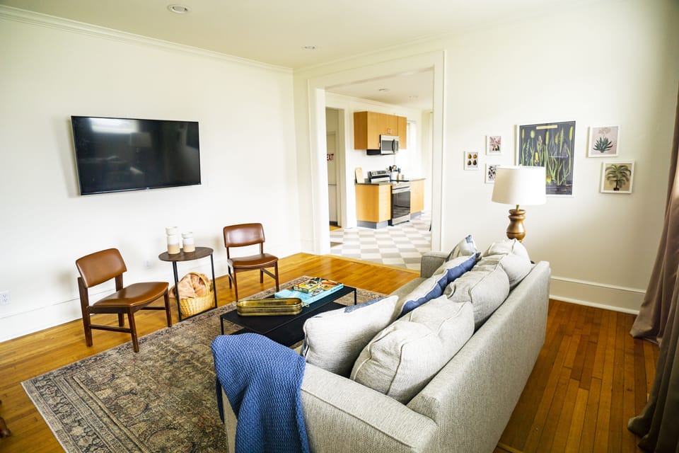 Pull up a comfy seat in the spacious living room while keeping an eye on dinner.