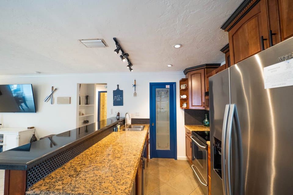 Large open kitchen with bar chairs