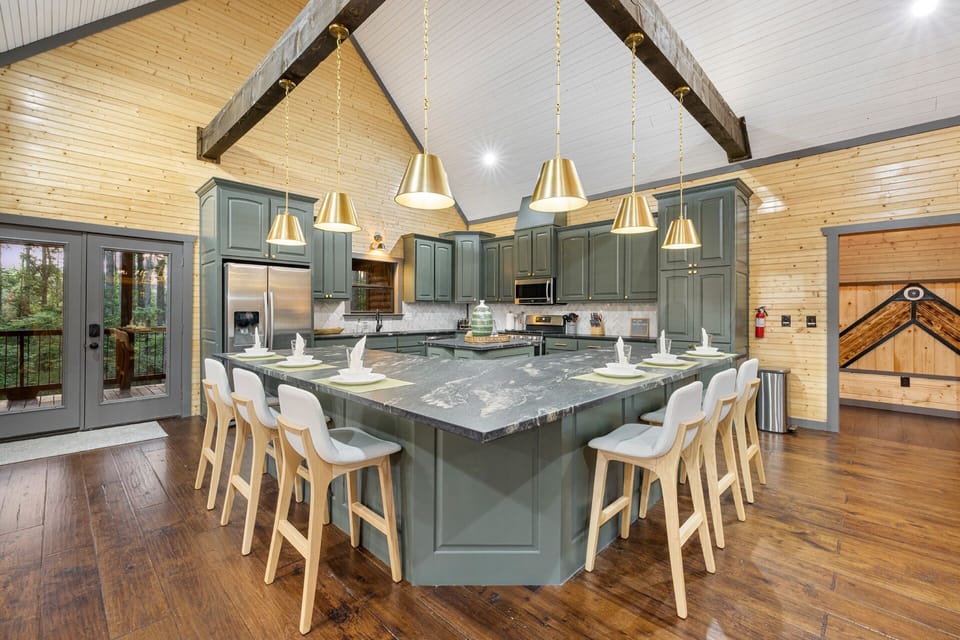 Madison Arbor's unique open kitchen features a chef island, ample cabinets, and counter space for culinary creativity!