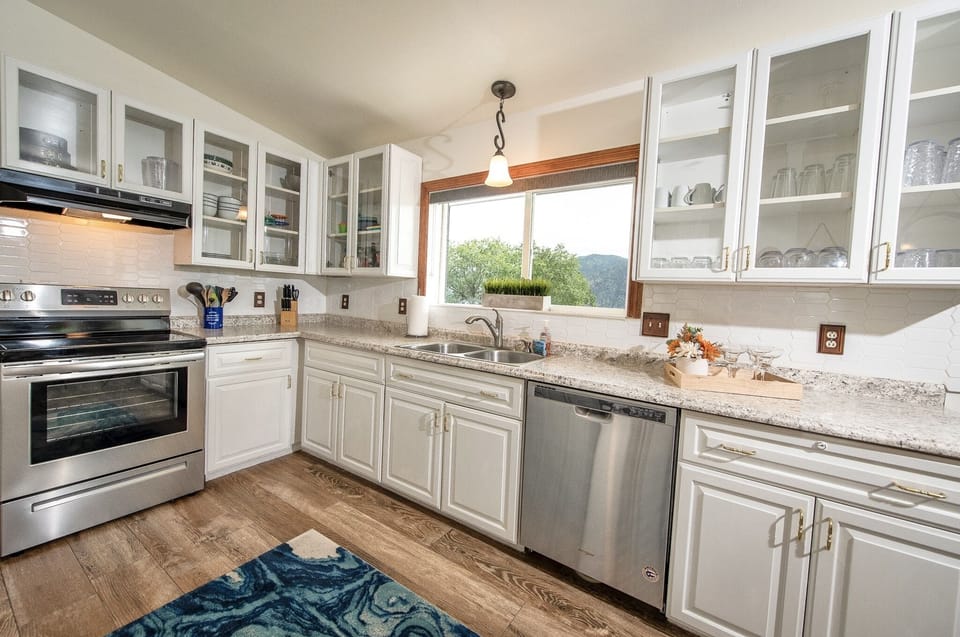 Fully equipped kitchen with electric stove