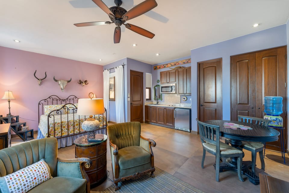 Bedroom 2 with TV, mini kitchen, undercounter fridge and private bath