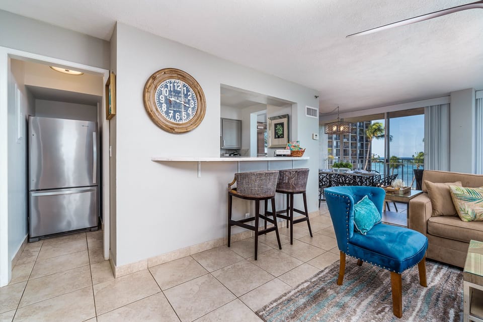 Conveniently stocked kitchen and bar seating.