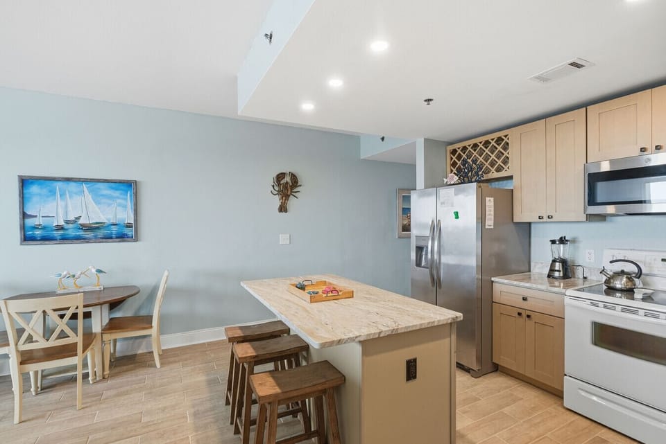 Enjoy meals together at the kitchen island with seating as well as at the dining table