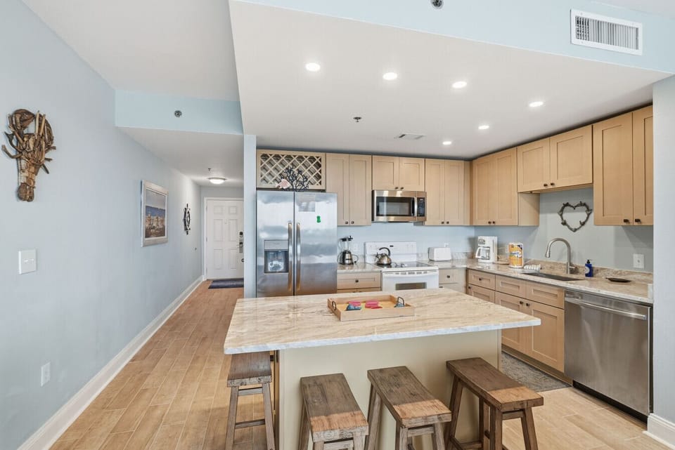 Enjoy meals together at the kitchen island with seating as well as at the dining table