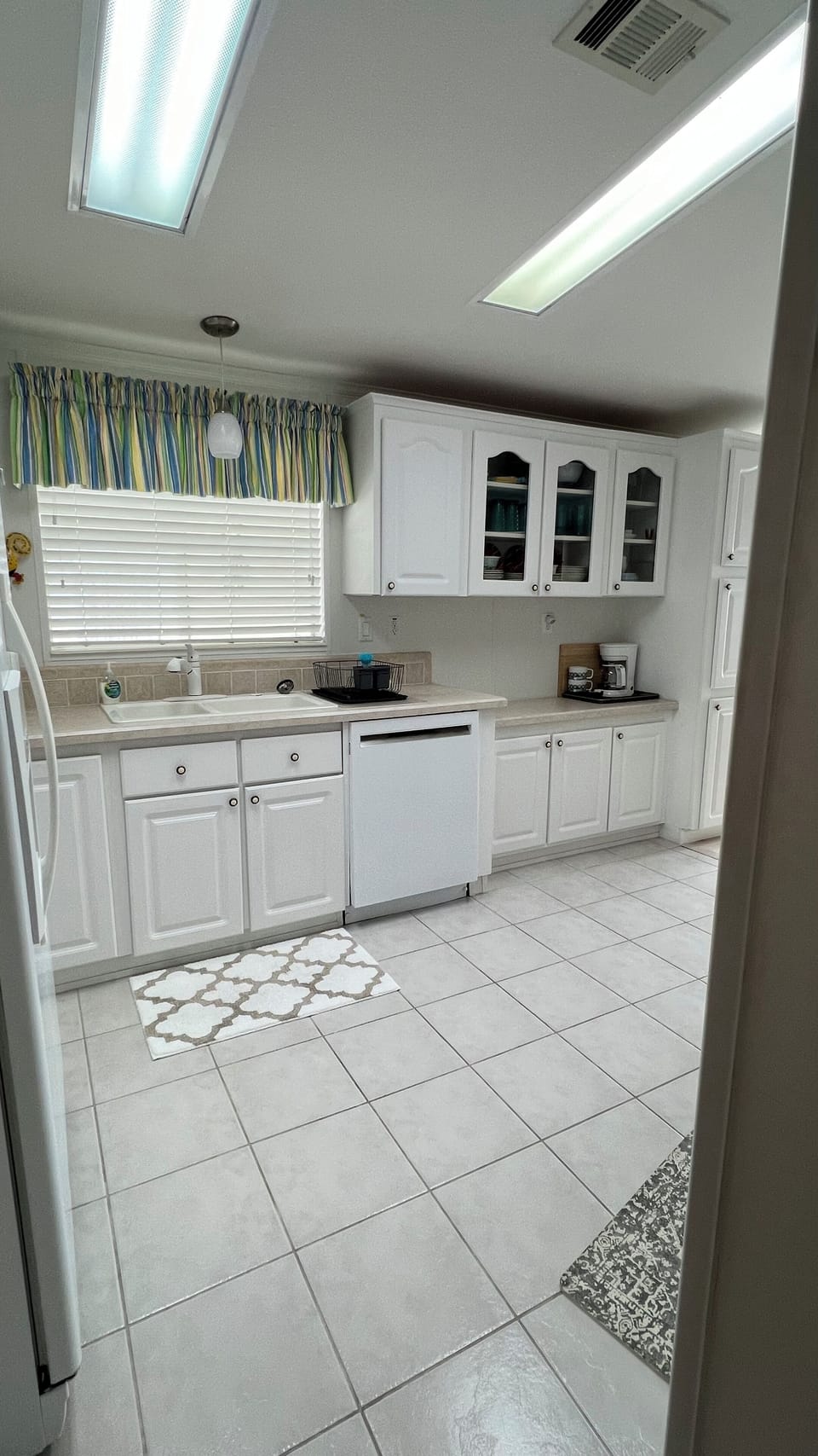 Large side by side fridge/freezer, generous counter space; toaster & coffee pot