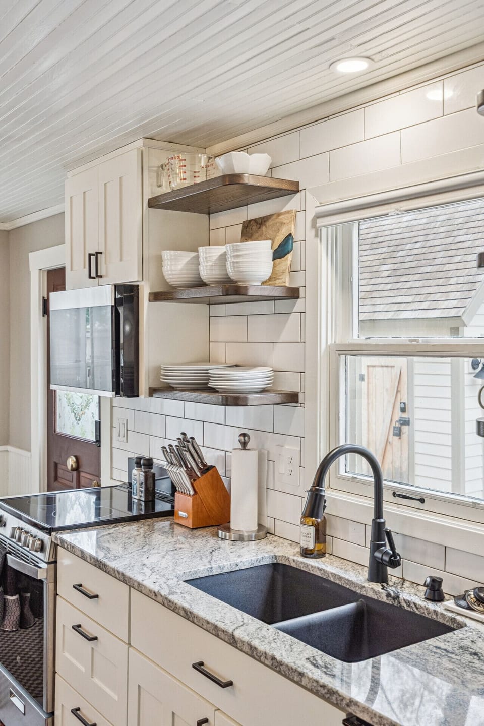 Fully stocked kitchen with stainless steel appliances