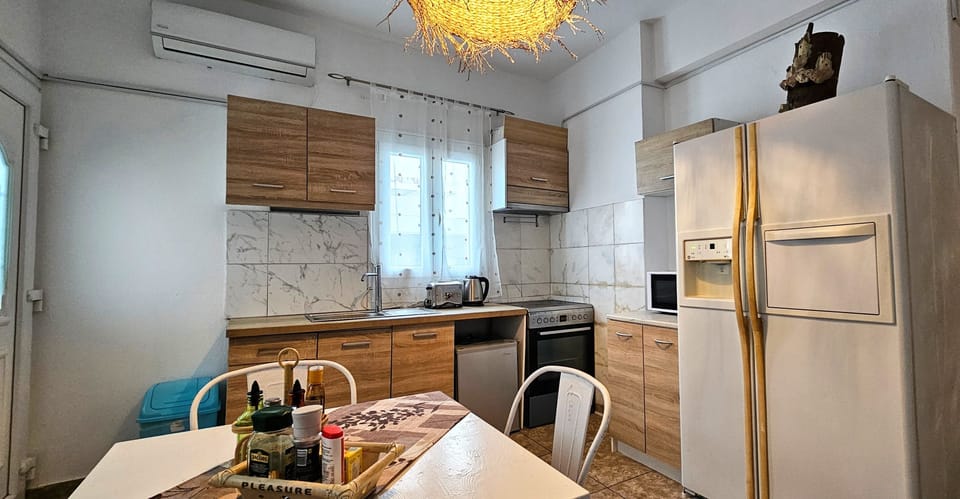 Family Apartment | Private kitchen | Fridge, microwave, coffee/tea maker, dining tables