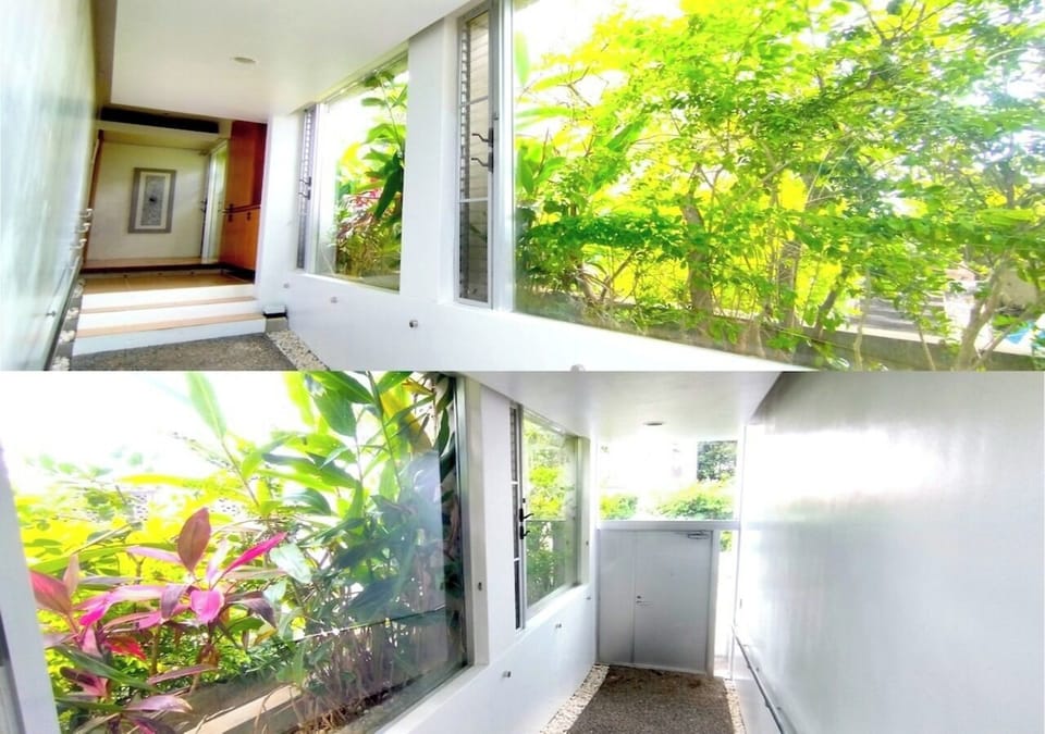 The large windows at the entrance allow lush trees and warm natural light to pour in, creating a heart-warming atmosphere.