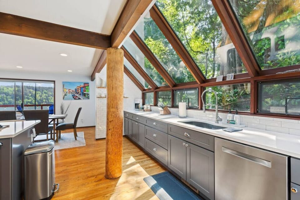 Stunning windows make you feel like you`re in nature while preparing family meals.