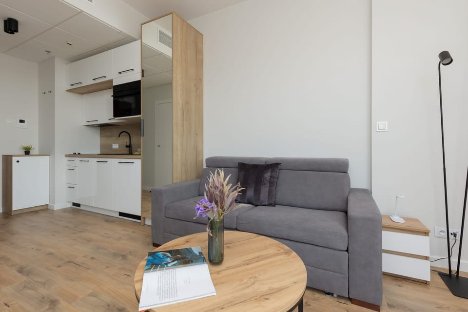 The living area's tasteful furnishings ensure a pleasant stay. 