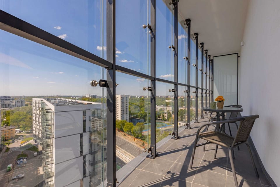 The balcony's stylish design complements the apartment's decor. 