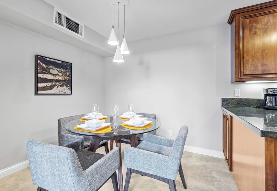 Dining area with modern seating and pendant lighting