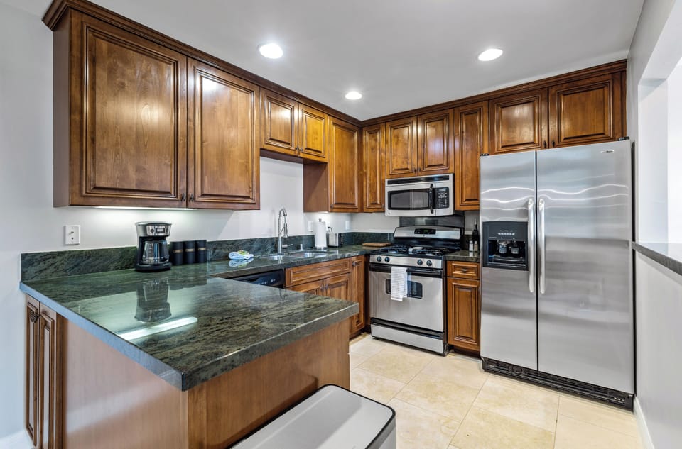 Fully equipped kitchen with granite counters and stainless appliances