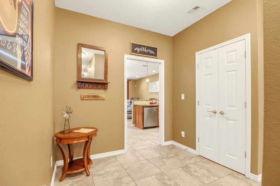 Step into your welcoming entry hall with warm tones and thoughtful touches that make you feel at home the moment you arrive.