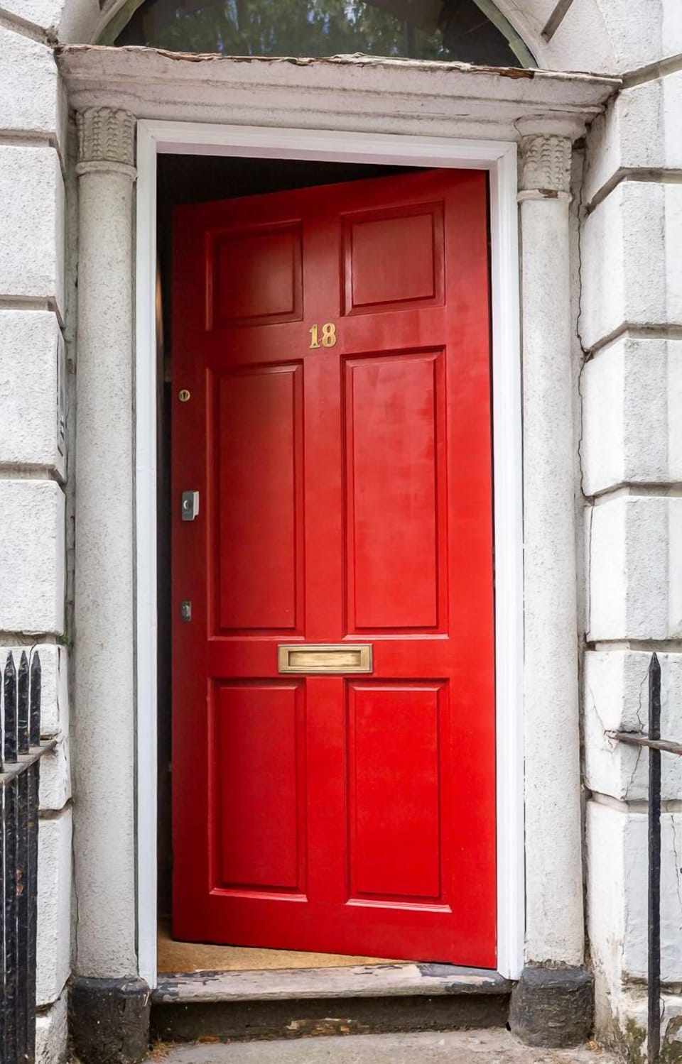 Red front door to 18 Ford Square