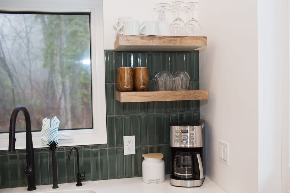 Coffee station with a Cuisinart coffee maker. We provide grinds and filters.