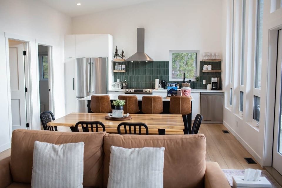 An open concept layout that keeps the living room, dining room, and kitchen connected. 