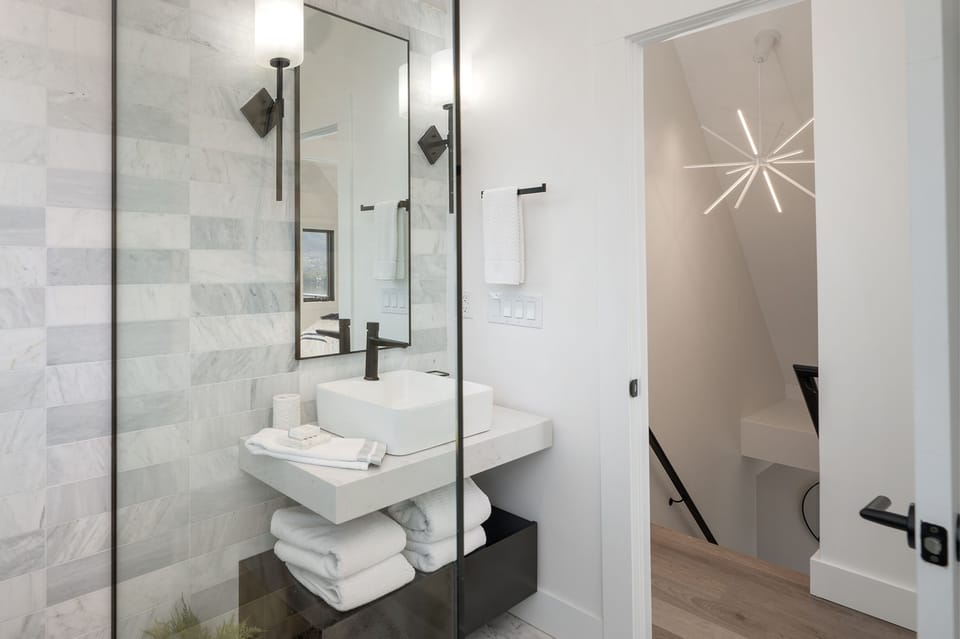 Step into a luxurious bathroom upstairs, designed for ultimate relaxation.
