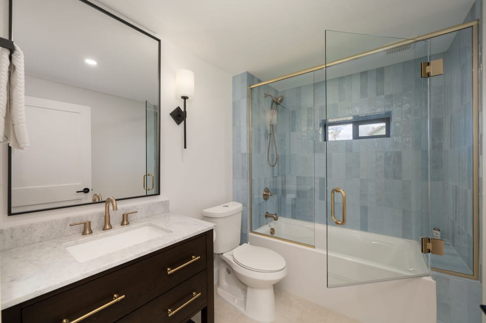 Downstairs bathroom, conveniently attached to the bedroom with two queen beds.