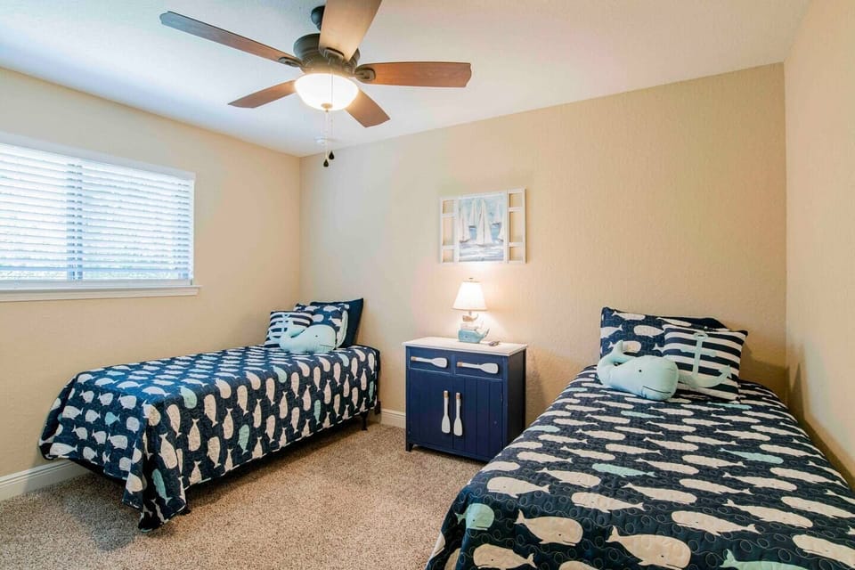 Kids will enjoy the nautical theme twin beds 