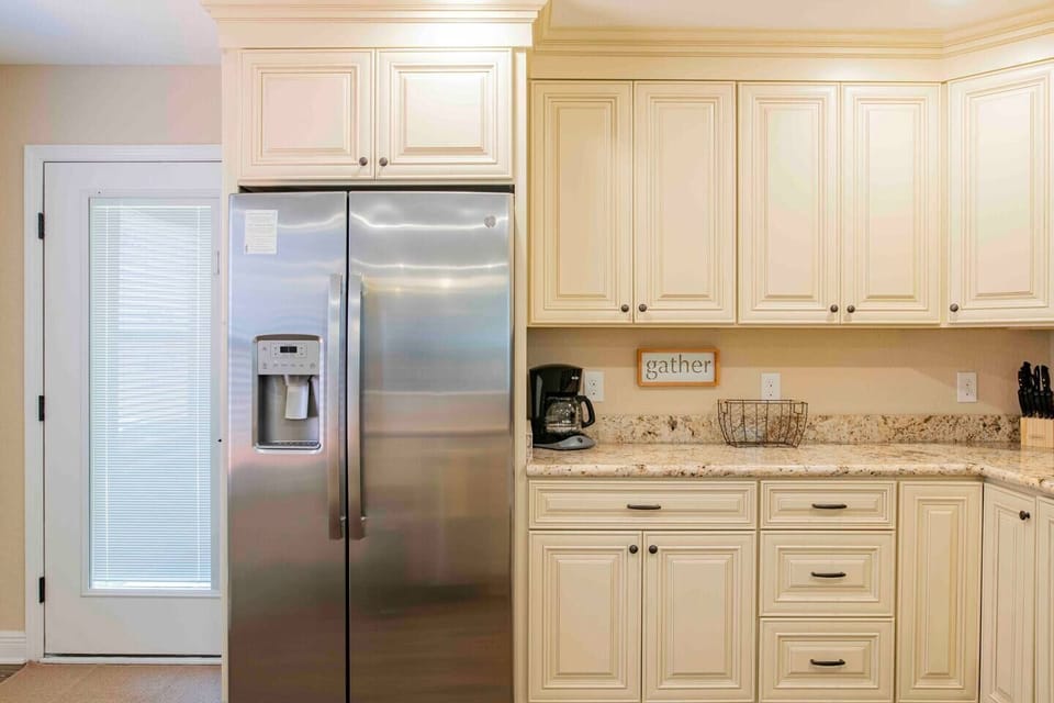 Side by side fridge with ice-maker and filtered water dispenser 