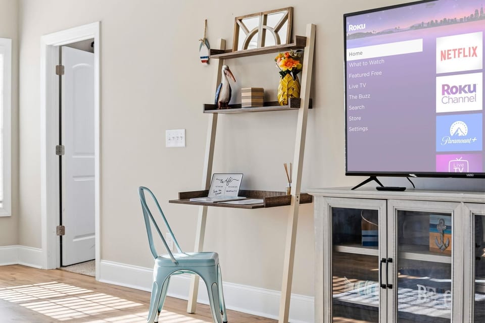 Cozy living room with smart TV and stylish workspace