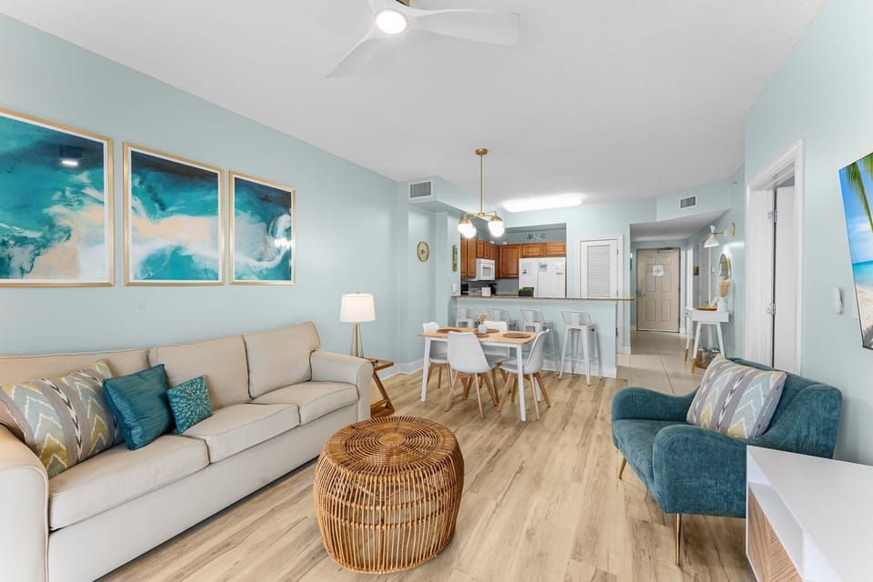 Spacious living room with Gulf views, premium sleeper sofa and large smart TV
