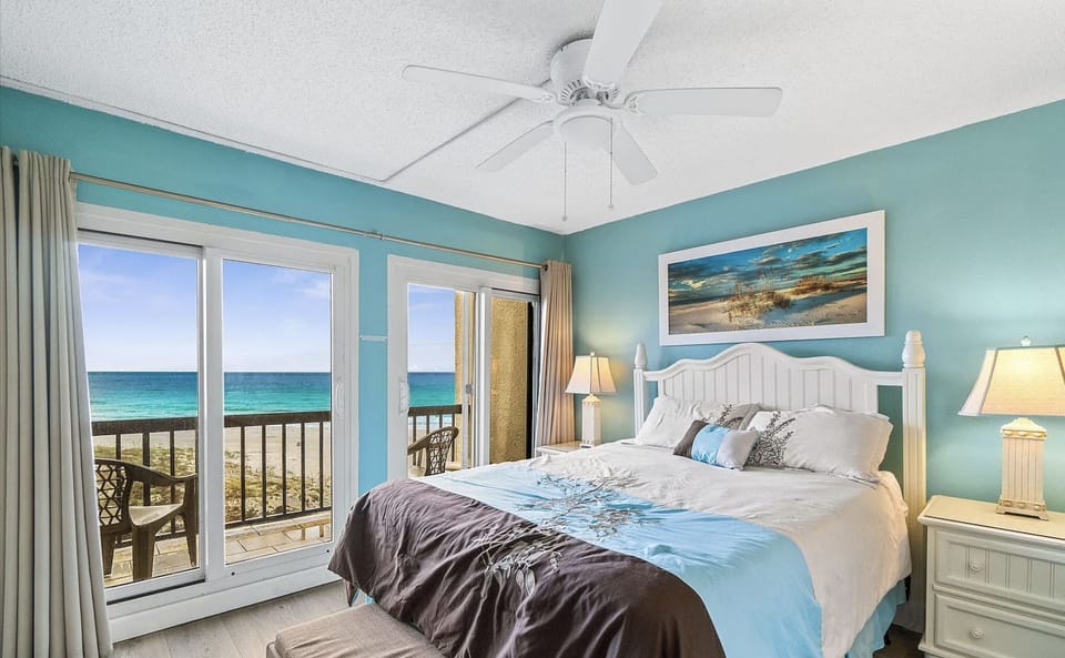 Master bedroom with breathtaking views of the Gulf and a private balcony. 