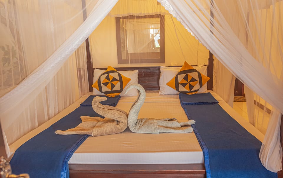 Family Quadruple Room, 1 King Bed, Non Smoking, Mountain View | Premium bedding, minibar, individually decorated, individually furnished