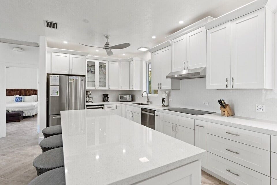 The expansive island offers plenty of seating and space for preparing memorable meals.