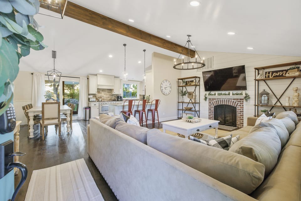 Main living room of the Verano home, large sectional, gas firepl