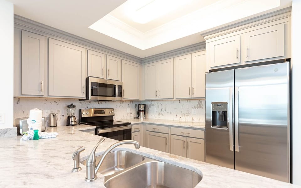 Condo, 2 Bedrooms | Private kitchen | Fridge, oven, coffee/tea maker