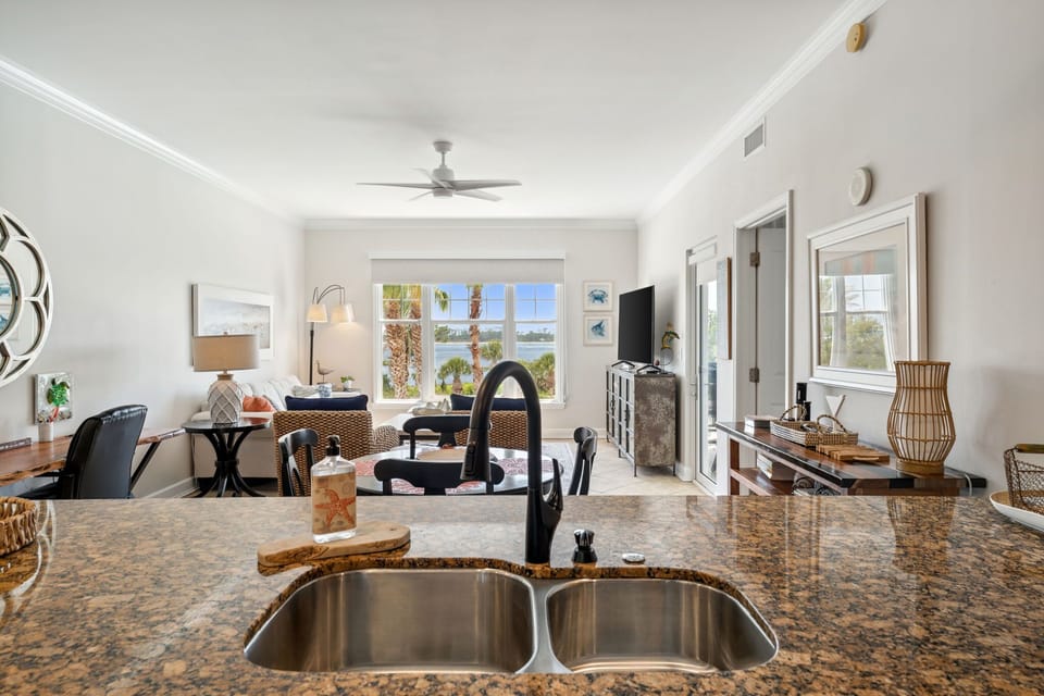 The fully equipped kitchen features granite countertops and stainless-steel appliances.