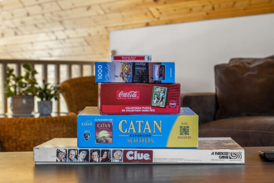 Upstairs loft area with plenty of seating options, a TV and board games.