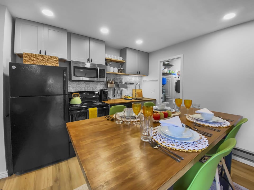 Cook with ease in our fully-equipped, modern kitchen! Features include sleek butcher block countertops, stainless steel appliances, a toaster, and coffee maker.