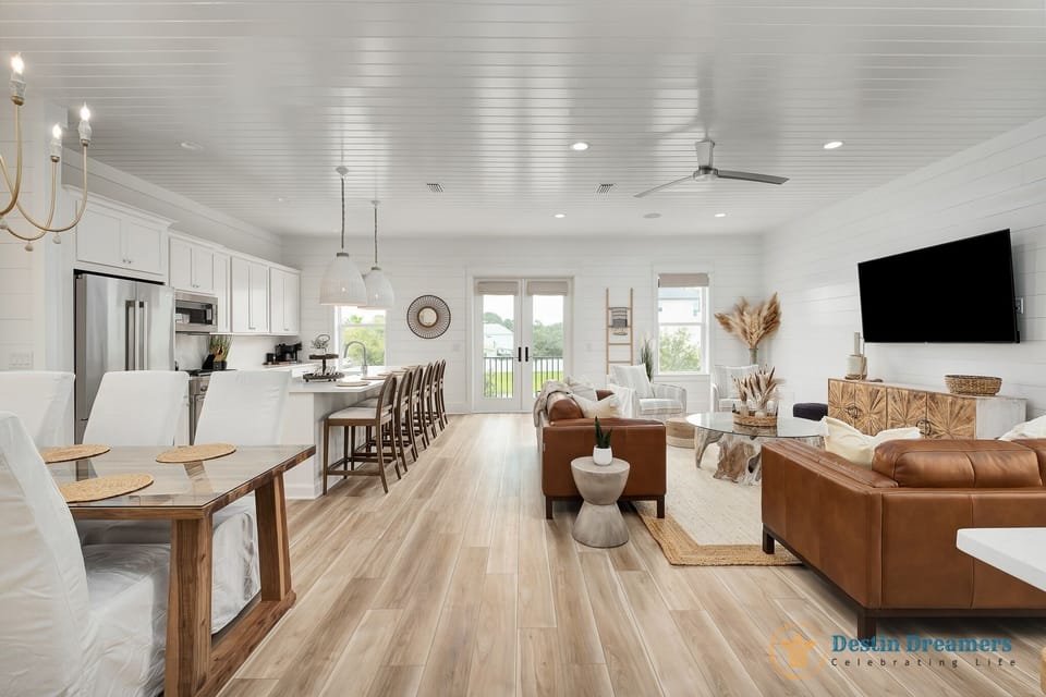 Spacious Living Room Connecting the Kitchen, Dining, and Balcony