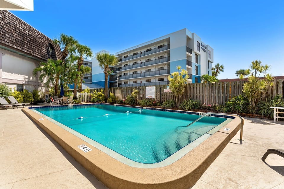 Step outside and feel the warm breeze—your private patio leads straight to the pool for effortless relaxation.