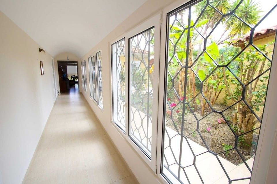Villa | Living area | 22-inch flat-screen TV with digital channels, plasma TV