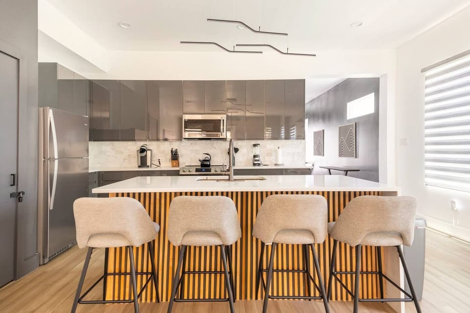 Open concept kitchen with all of the cooking supplies and tools needed.
