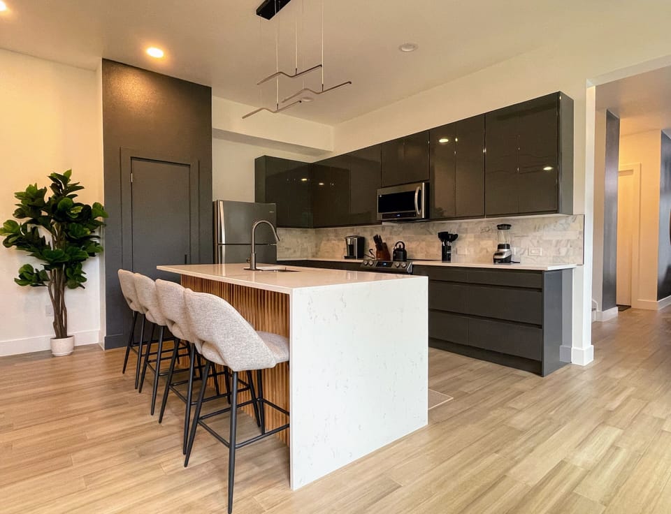Open concept kitchen with all of the cooking supplies and tools needed.