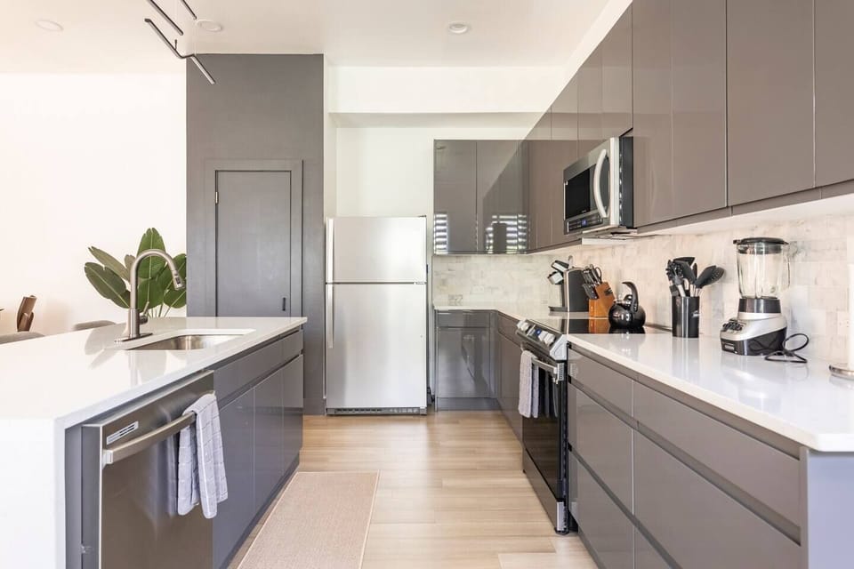 Open concept kitchen with all of the cooking supplies and tools needed.