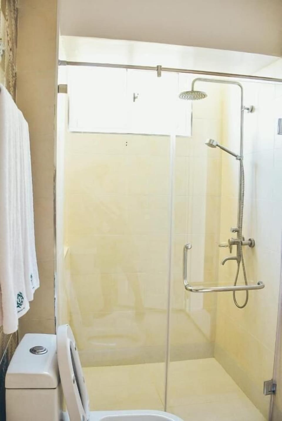 Shower, hair dryer, slippers, towels