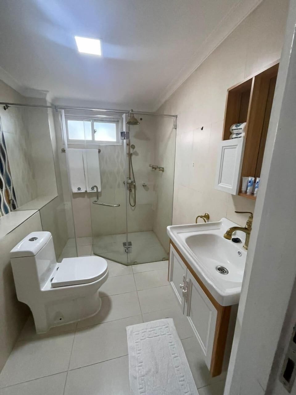 Shower, hair dryer, slippers, towels