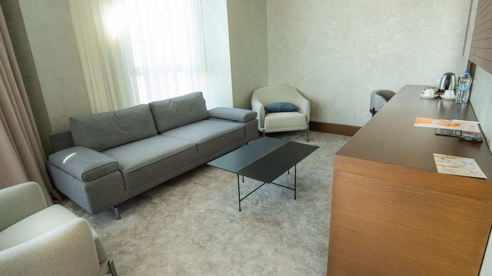Junior Suite, 1 Queen Bed with Sofa bed | Living area | 110-inch Smart TV with satellite channels, TV