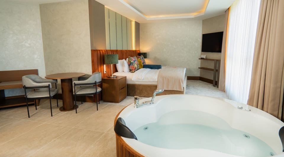 Junior Suite, 1 Queen Bed with Sofa bed | Living area | 110-inch Smart TV with satellite channels, TV
