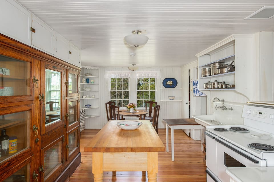 Eat-in kitchen with original ice box pantry and refinished farm sink