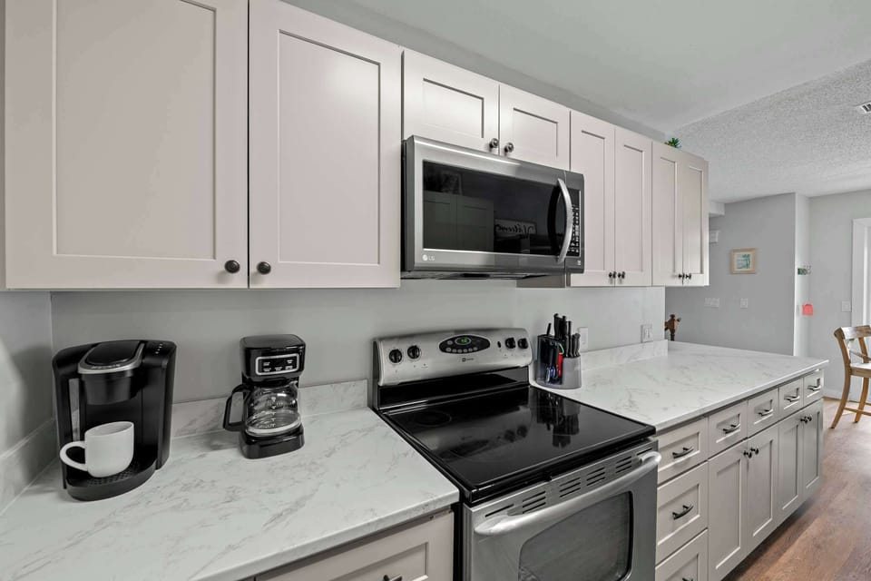 Our kitchen is directly off the dining area, with a simple place to cook your meals in during your stay.