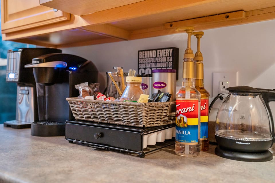 Fully stocked coffee bar with complimentary coffee, tea, cocoa and condiments.