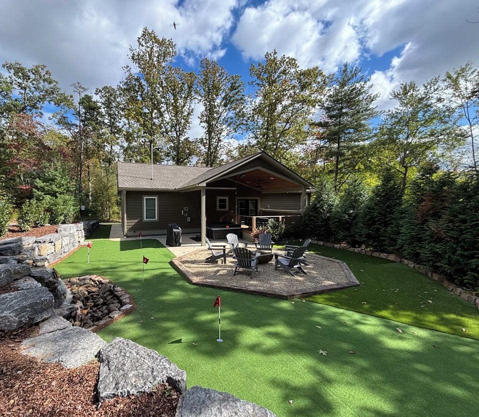 Backyard - Putting green, waterfall (seasonal), fire pit, hot tub, projector.